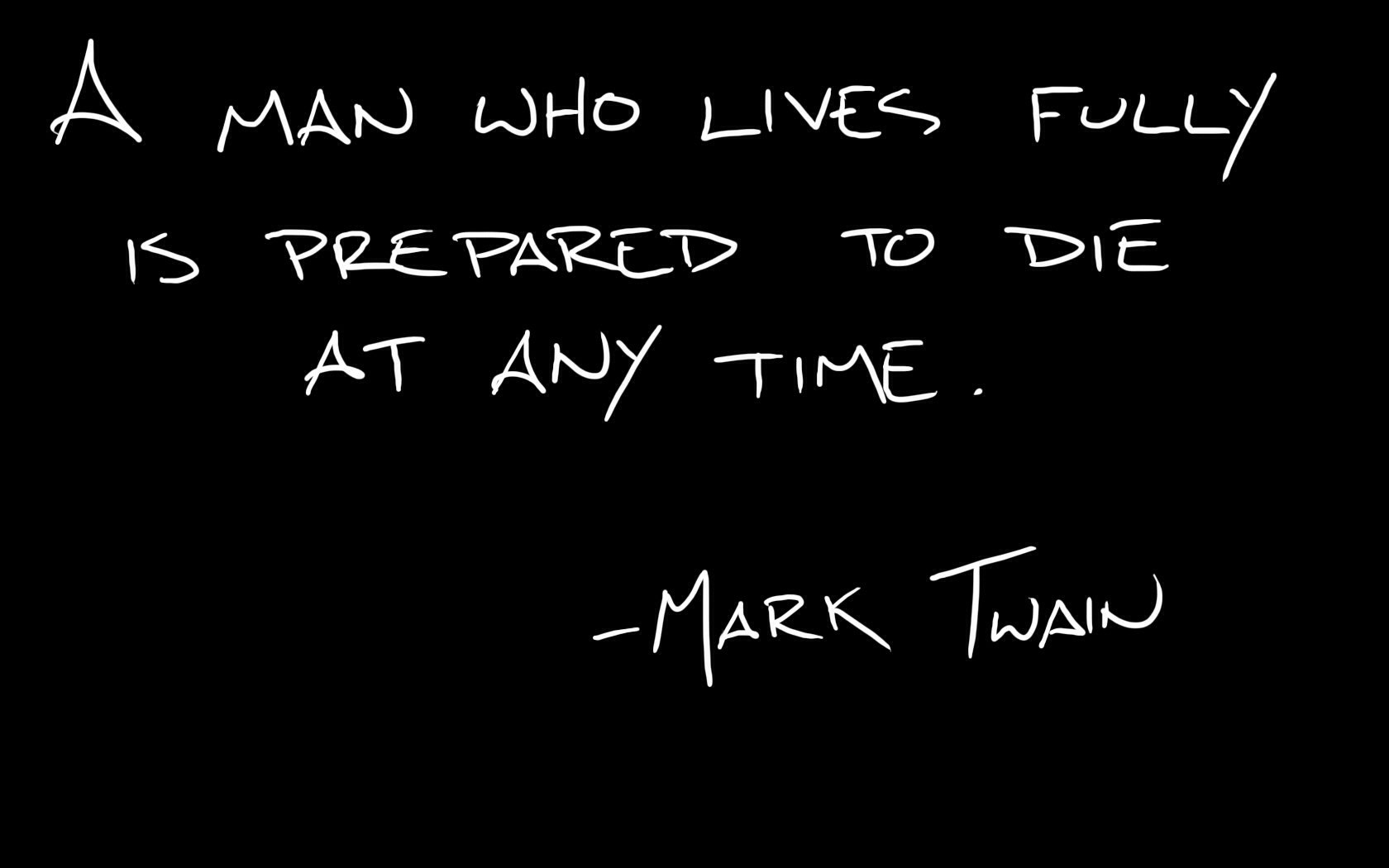 A minimalist HD desktop wallpaper featuring a quote by Mark Twain: “A man who lives fully is prepared to die at any time,” set against a sleek black background.