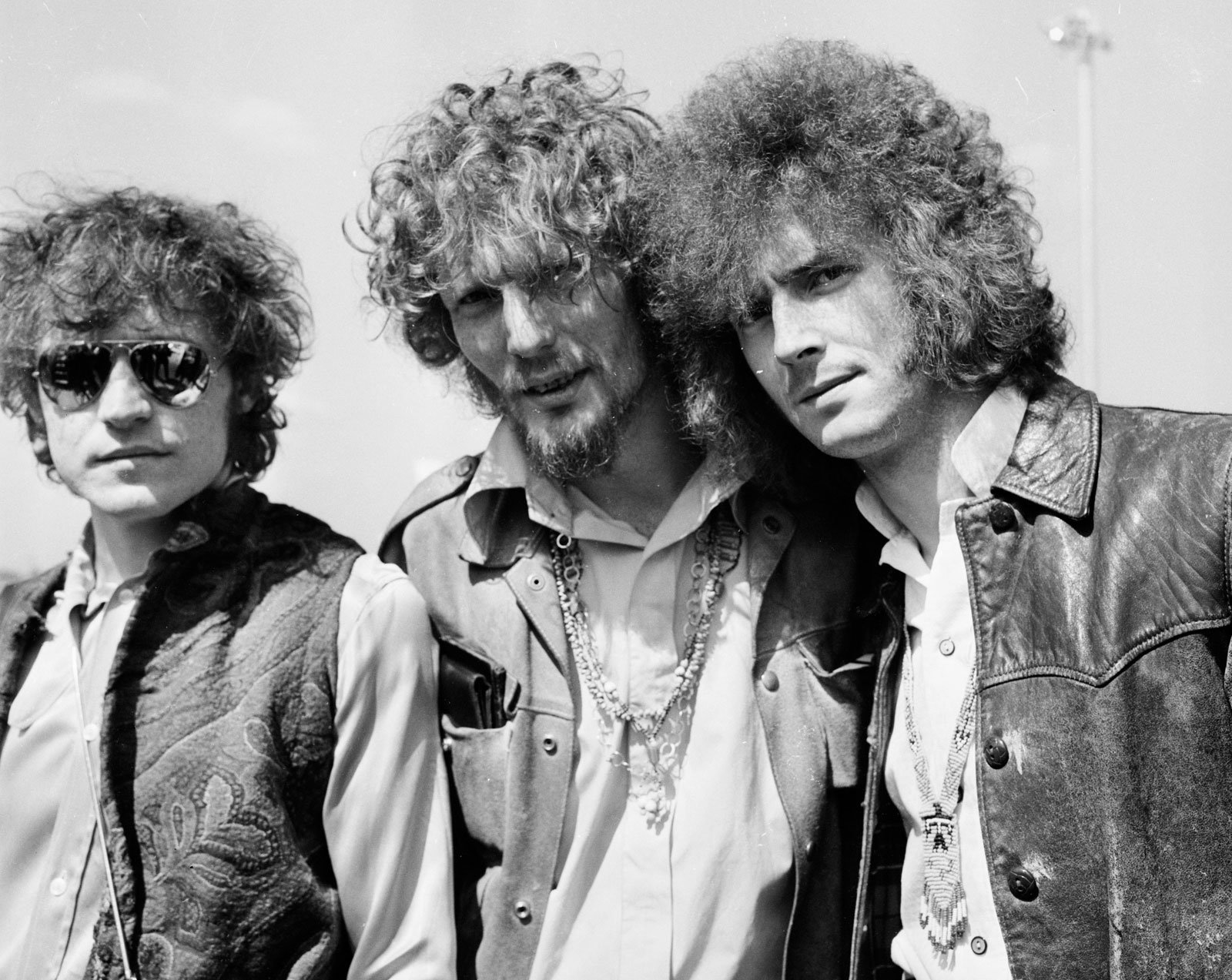 Black and white HD desktop wallpaper featuring the rock band Cream, showcasing three members with distinctive 1960s style and textured hair.