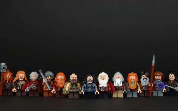 A collection of Hobbit-themed LEGO figures arranged against a dark background, showcasing intricate details and vibrant colors in this HD PC desktop wallpaper.