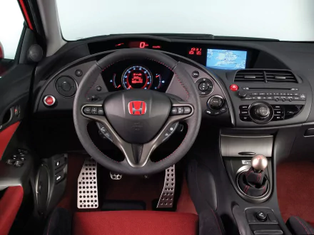 HD wallpaper featuring the stylish interior of a Honda Civic, showcasing a sleek dashboard with a modern design and advanced technology.