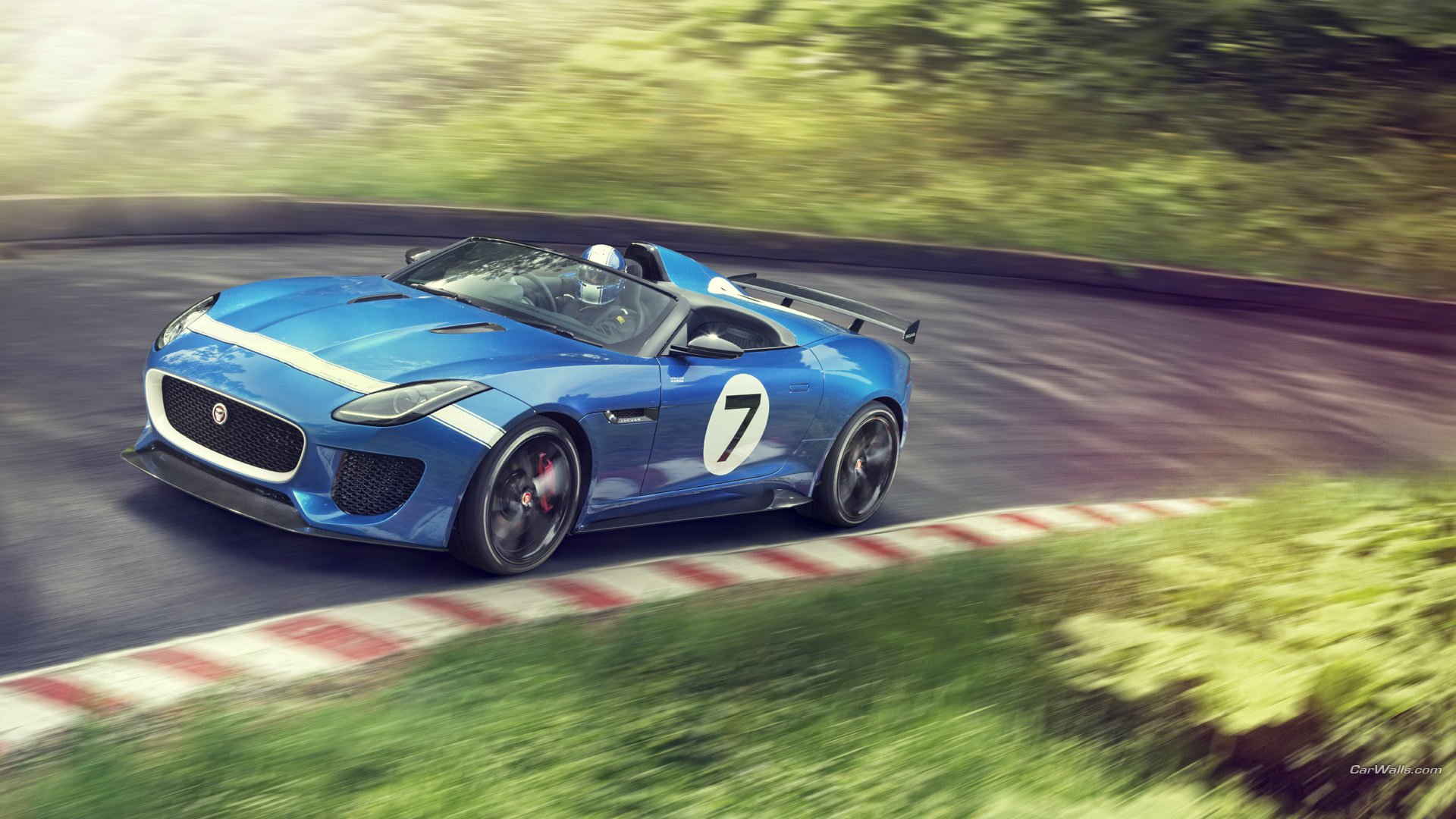 Blue 2013 Jaguar Project 7 Concept sports car with racing number 7 speeding on a curving track; HD PC desktop wallpaper/background.