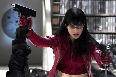 HD PC desktop wallpaper featuring a scene from the movie Ultraviolet, showing the protagonist in a red jacket aiming two guns in an intense action moment.