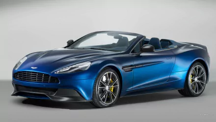 Blue 2014 Aston Martin Vanquish Volante vehicle, convertible, front three-quarter view on neutral backdrop — HD PC desktop wallpaper and background.