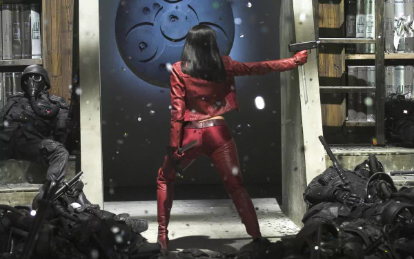 HD PC desktop wallpaper from the movie Ultraviolet, featuring a woman in a red suit confronting armed soldiers in a high-intensity action scene.