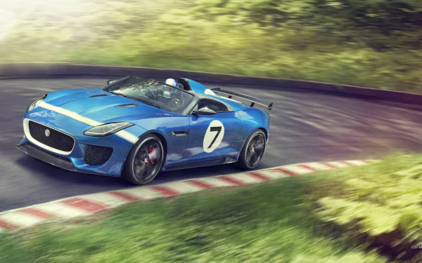 Blue 2013 Jaguar Project 7 Concept sports car with racing number 7 speeding on a curving track; HD PC desktop wallpaper/background.