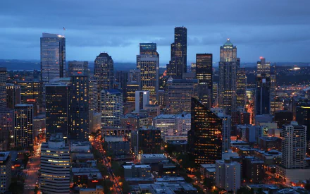 HD PC desktop wallpaper/background: Seattle man-made skyline at dusk with illuminated downtown high-rises and streets.