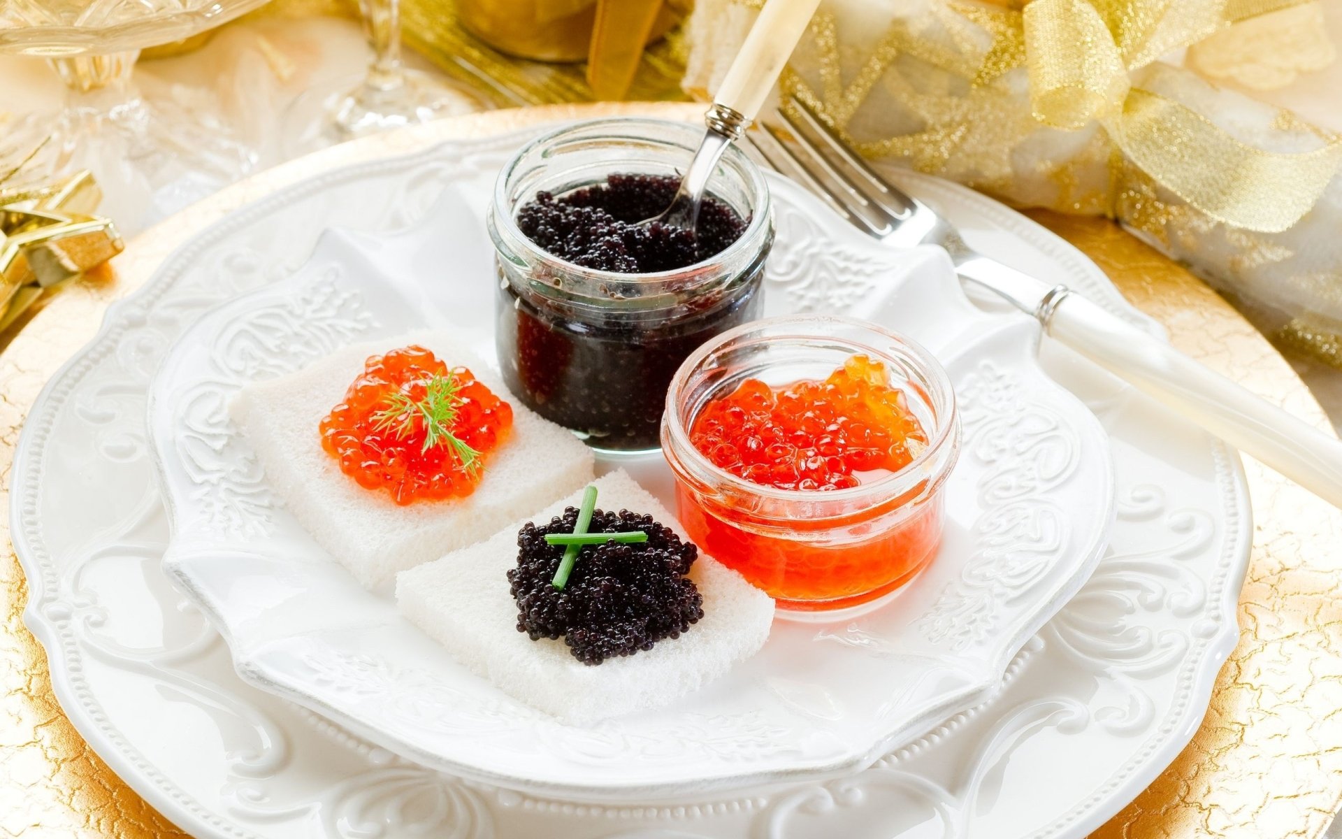 Close-up of black and red caviar with garnishes on a white plate — food, caviar; 2K Quad HD PC desktop wallpaper background.