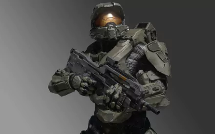 HD PC desktop wallpaper featuring a detailed image of Master Chief from the video game Halo 4, holding a futuristic weapon against a gray background.