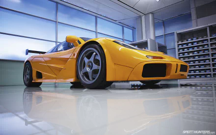 A stunning McLaren F1 in vibrant orange, showcased in a sleek, modern garage setting. This HD image serves as an engaging desktop wallpaper, highlighting automotive excellence.