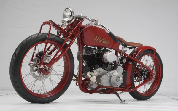 HD desktop wallpaper featuring a classic red Indian motorcycle, showcasing the vintage vehicle's detailed design and iconic branding.