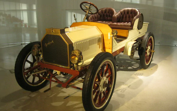 HD PC desktop wallpaper featuring a vintage Peugeot vehicle with a classic open-top design and wooden accents, showcasing early automotive craftsmanship.