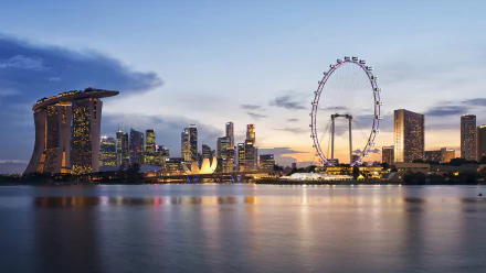 4K Ultra HD desktop wallpaper showcasing Singapore’s skyline at dusk with Marina Bay Sands and the Singapore Flyer illuminated along the waterfront.