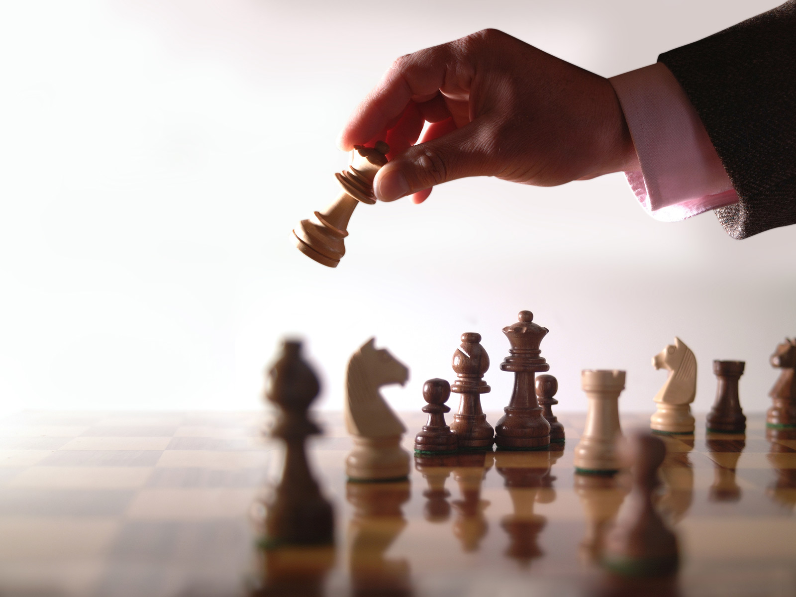 Selective focus Mans hand in chess play, metaphorically guiding strategic  business decisions Vertical Mobile Wallpaper AI Generated 30463882 Stock  Photo at Vecteezy