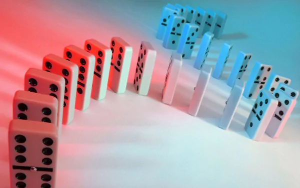 HD PC desktop wallpaper of man-made dominos arranged in curved rows, white tiles with black pips illuminated by contrasting red and blue light.