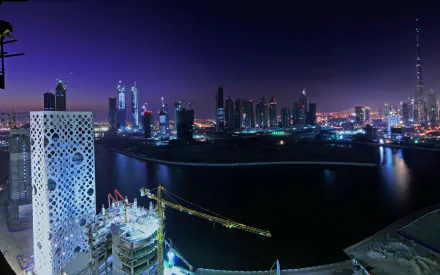 HD PC desktop wallpaper showcasing Dubai's illuminated man-made skyline and iconic skyscrapers glowing against the night sky.