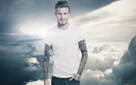 A dynamic HD wallpaper featuring David Beckham against a dramatic cloud backdrop, showcasing his tattoos and confident pose, celebrating his iconic presence in sports.