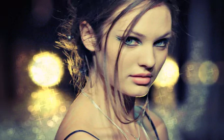 HD desktop wallpaper of South African woman Candice Swanepoel with a blurred bokeh background, giving a dreamy, glowing effect to her portrait.