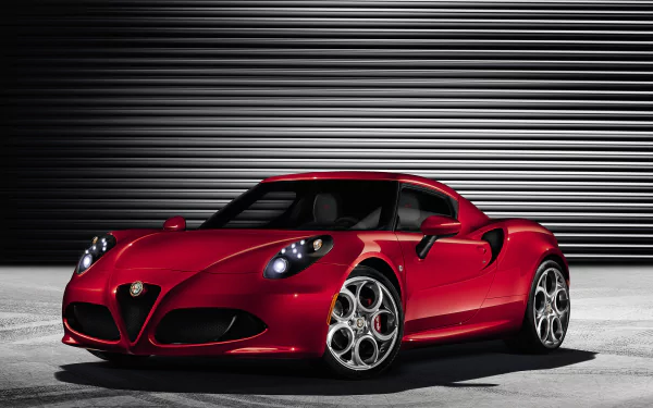 Red Alfa Romeo 4C vehicle parked against a ribbed metal backdrop, high‑detail 2K Quad HD PC desktop wallpaper.