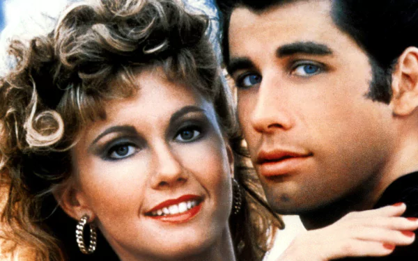 HD desktop wallpaper featuring close-up of Sandy and Danny from the movie Grease, capturing their iconic 1950s look and chemistry.
