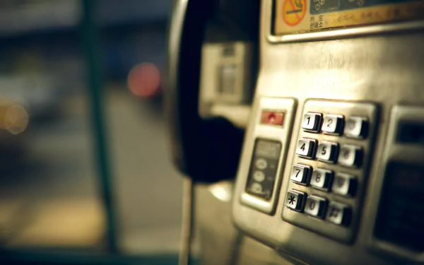 Close-up of a man-made telephone keypad on a vintage payphone, captured in HD quality, creating a sharp and detailed PC desktop wallpaper and background.