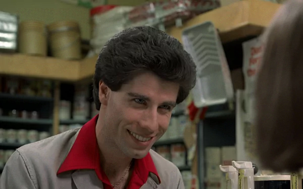 HD PC desktop wallpaper of a smiling man in a 1970s grocery setting with disco-era styling and a movie-inspired Saturday Night Fever vibe.