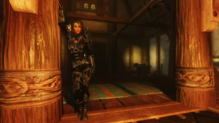 HD desktop wallpaper featuring a dark-armored character from the video game The Elder Scrolls V: Skyrim standing in a warmly lit wooden interior.