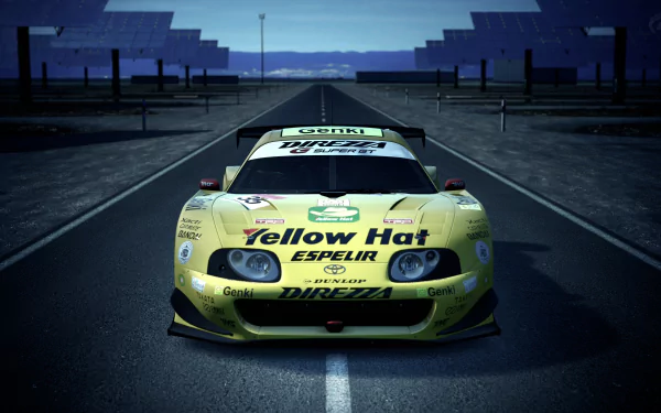 Yellow Toyota Supra race car from Gran Turismo 6 sits centered on a wet racetrack — 4K Ultra HD PC desktop wallpaper and background celebrating the Gran Turismo video game