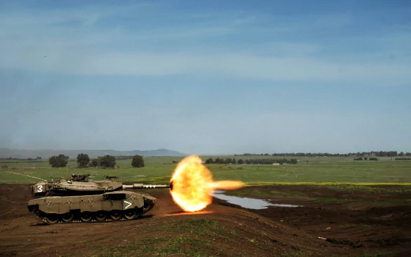 HD desktop wallpaper featuring a Merkava tank of the army firing on an open field under a clear sky.