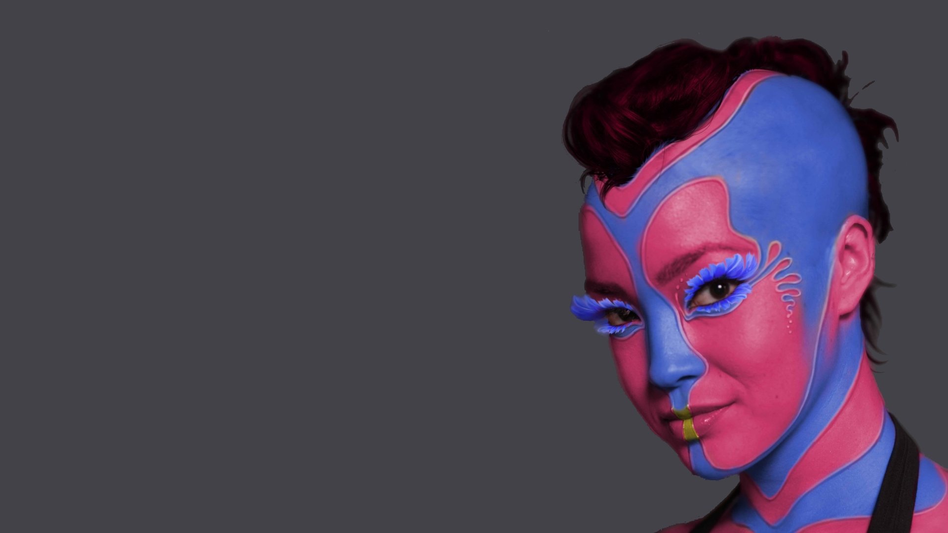 A close-up 4K Ultra HD PC wallpaper of a character with blue and pink face paint, inspired by the movie Star Trek Into Darkness.
