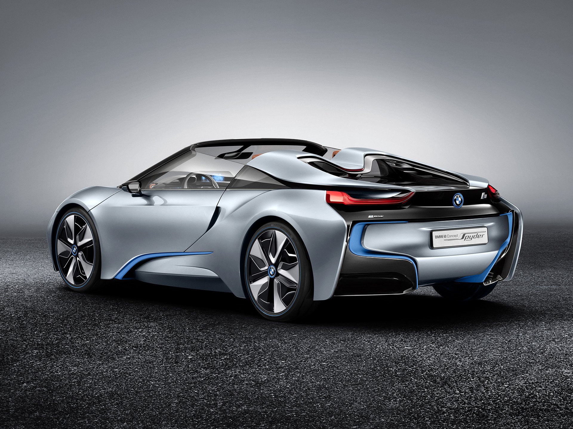 Silver BMW i8 Concept Spyder sports car showcased in a sleek HD desktop wallpaper, highlighting its futuristic design and dynamic curves.