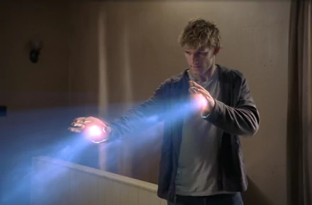 Alex Pettyfer portrays a character wielding energy in this captivating scene from the movie I Am Number Four. This HD wallpaper features dramatic visuals and engaging action.