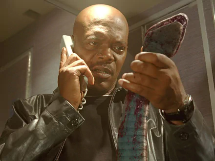 HD wallpaper featuring Samuel L. Jackson in a tense scene from Snakes on a Plane, suitable as a desktop background.