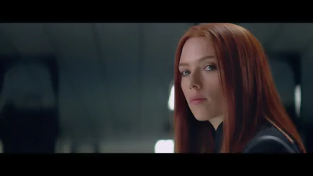 Scarlett Johansson as Black Widow in Captain America: The Winter Soldier, showcasing her fierce gaze in this HD desktop wallpaper. A captivating scene for any fan of the movie.