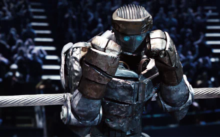 A dramatic scene from the movie Real Steel featuring a powerful robot in the ring, showcasing intense emotion and anticipation. This high-definition wallpaper creates an engaging backdrop.