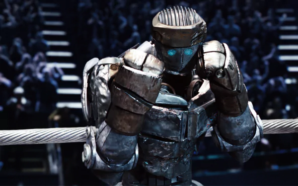 A dramatic scene from the movie Real Steel featuring a powerful robot in the ring, showcasing intense emotion and anticipation. This high-definition wallpaper creates an engaging backdrop.