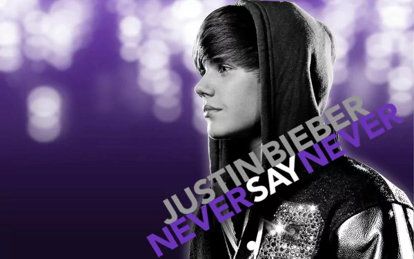 HD desktop wallpaper featuring a black and white profile of Justin Bieber with purple bokeh background and Never Say Never text.