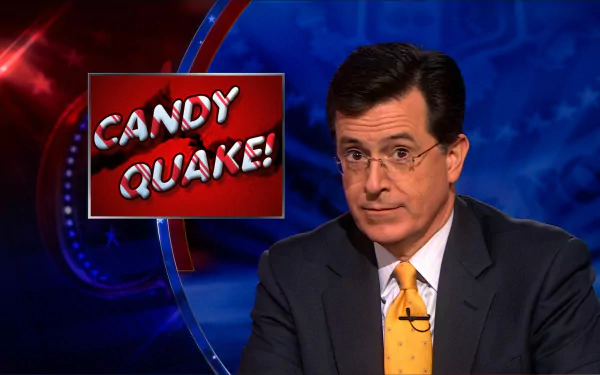 HD desktop wallpaper of Stephen Colbert from The Colbert Report, with a CANDY QUAKE! caption.