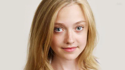 Portrait of American actress Dakota Fanning, featuring her blonde hair and expressive blue eyes, suitable as a high-definition desktop wallpaper or background.