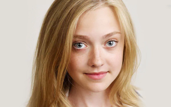 Portrait of American actress Dakota Fanning, featuring her blonde hair and expressive blue eyes, suitable as a high-definition desktop wallpaper or background.