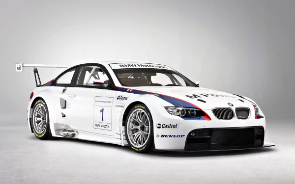 HD desktop wallpaper featuring a white BMW M3 GT2 race car with sponsor decals and detailed design against a plain background.