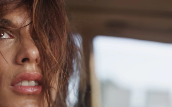 Close-up of Italian actress and celebrity Elisabetta Canalis with tousled hair, captured in a 4K Ultra HD desktop wallpaper background.