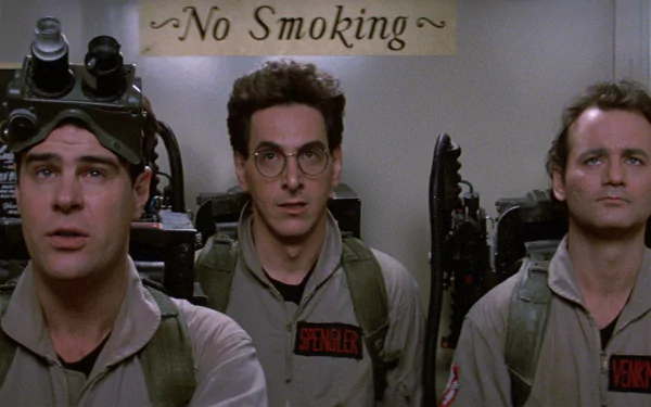 HD wallpaper featuring the Ghostbusters with Bill Murray, suited up with ghost-hunting gear.