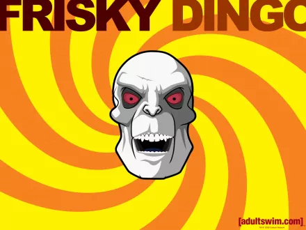 HD desktop wallpaper featuring the skull-faced character and bold text from the TV show Frisky Dingo against a vibrant yellow and orange spiral background.