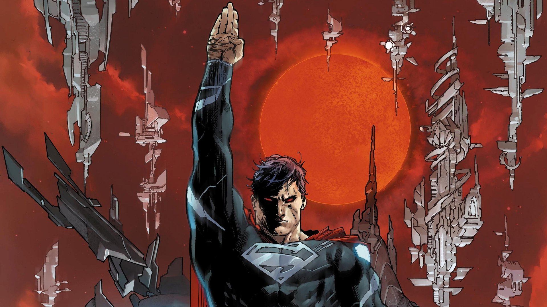 A striking HD desktop wallpaper featuring Superman, who stands confidently against a dramatic red backdrop with futuristic structures, embodying strength and heroism in this comic-inspired scene.