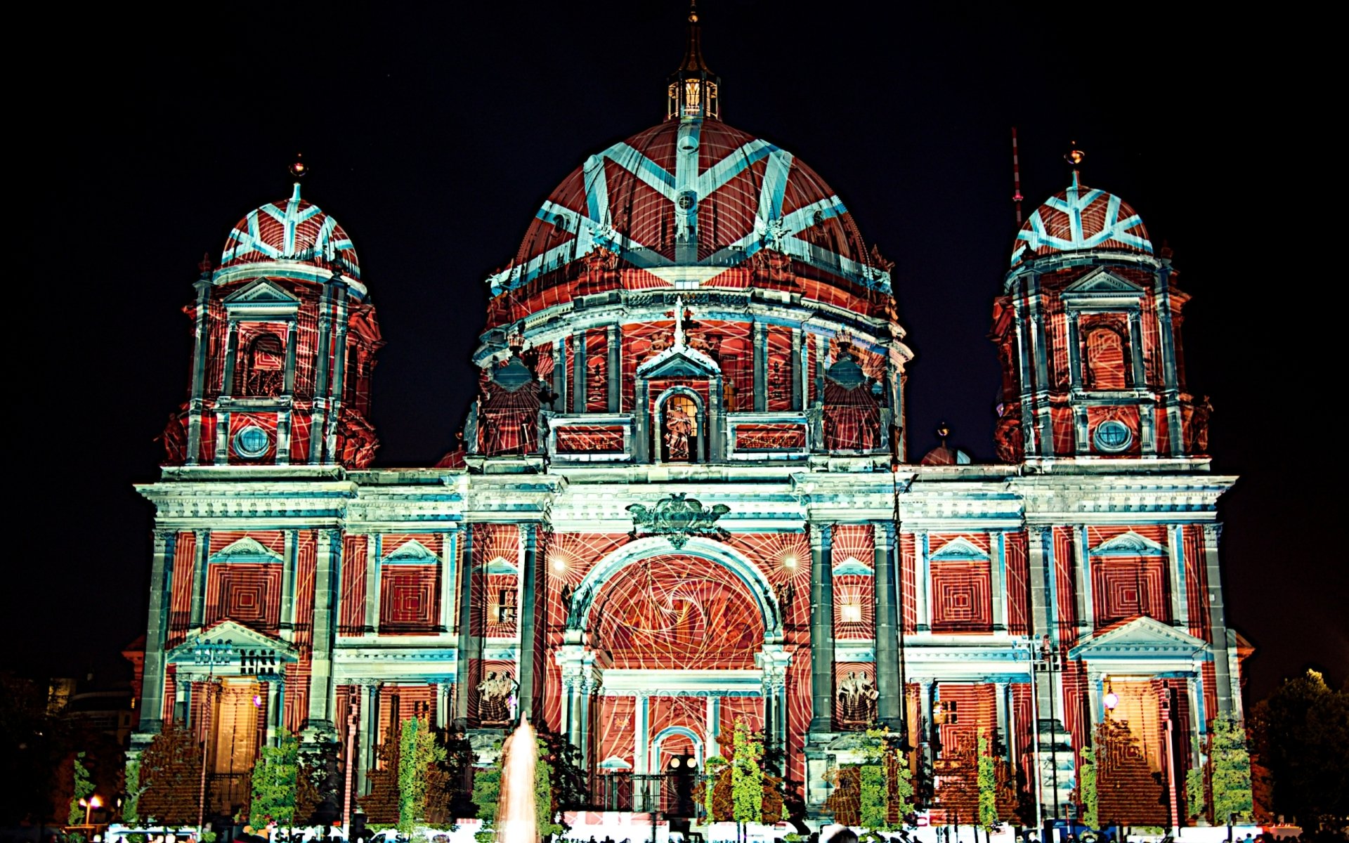 Artistic Festival of Lights — Berlin Cathedral bathed in colorful projection mapping at night; 2K Quad HD PC desktop wallpaper and background.