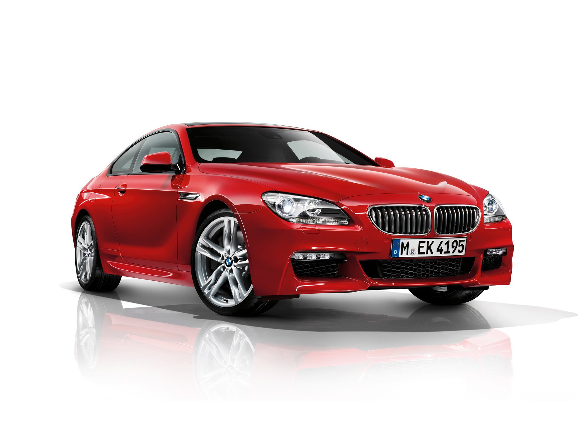 Red BMW 6 Series Coupé showcased on a white background, captured in a high-definition PC desktop wallpaper style.
