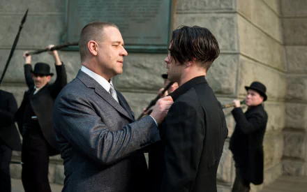 Two men in period coats face off on stone steps while thugs loom behind — Winter's Tale movie wallpaper with Pearly Soames and Peter Lake, 2K Quad HD.