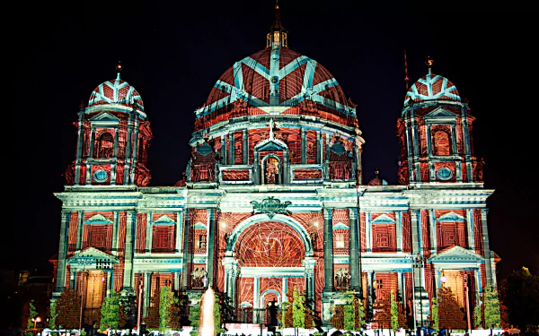 Artistic Festival of Lights — Berlin Cathedral bathed in colorful projection mapping at night; 2K Quad HD PC desktop wallpaper and background.