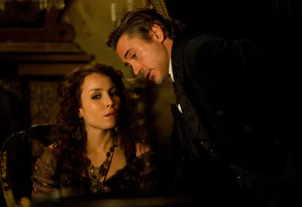 A dramatic scene from Sherlock Holmes: A Game of Shadows featuring Noomi Rapace and Robert Downey Jr., showcasing the intriguing dynamics between their characters.