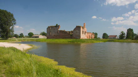 HD desktop wallpaper showcasing the historic man-made Besiekiery Castle surrounded by water under a bright blue sky.
